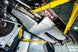 JLU 4XE Bellypan Skid with Power Pack & Exhaust Skids, gray metal, underside view on lift – Artec Industries