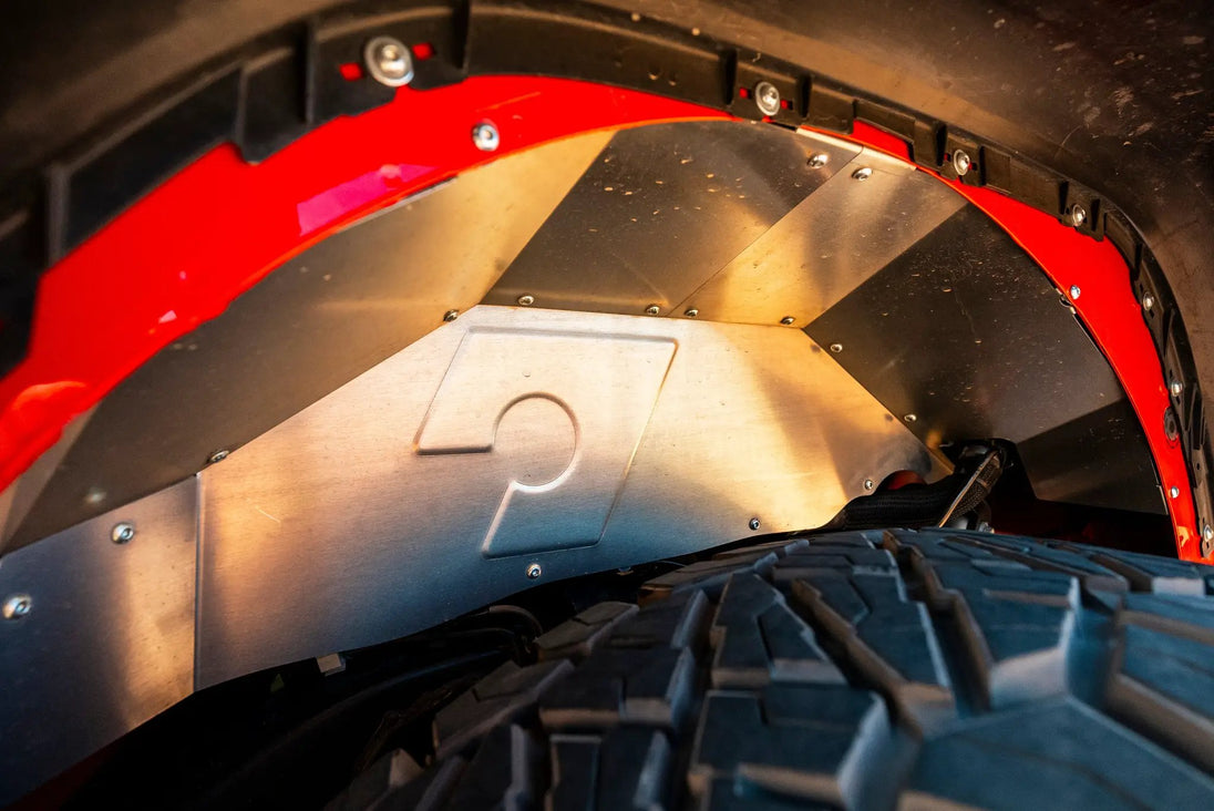 Artec JL Rear Inner Fenders, metal panels with rivets and red wheel-arch lip