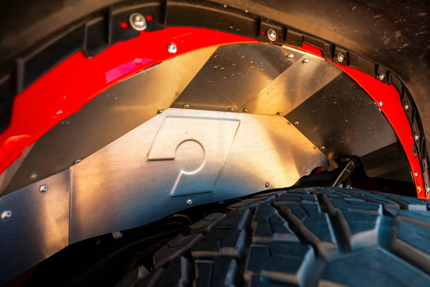 Artec JL Rear Inner Fenders, metal panels with rivets and red wheel-arch lip