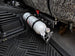 OBS Ford Fire Extinguisher Mount JC Customs—white extinguisher secured in black metal bracket under the seat