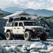 Gen2 Overlander Standard Tent, gray, by Smittybilt, mounted on SUV.