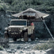 Gen2 Overlander Standard Tent by Smittybilt, gray, mounted on a Jeep roof rack
