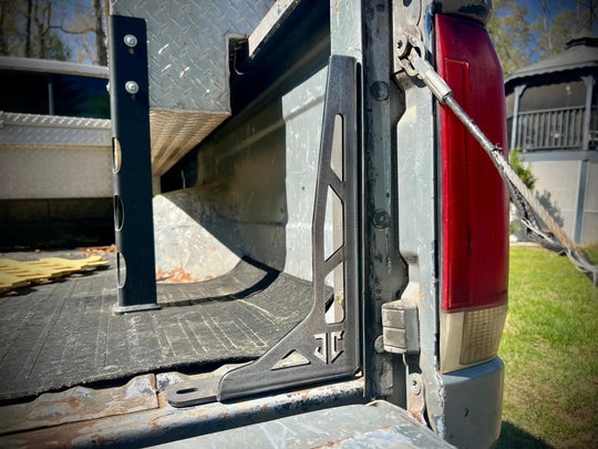 JC Customs Bed Stiffeners/Bed Tie Downs for 1980-1997 Ford F-Series pickup; black metal brackets along bed rail
