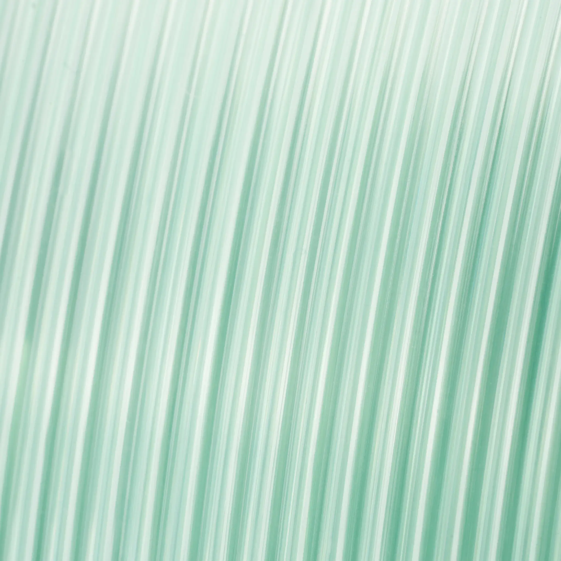 PETG Translucent filament by Numakers, a 3D printer accessory in pale teal.