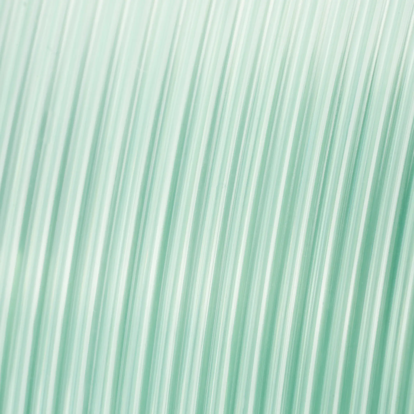 PETG Translucent filament by Numakers, a 3D printer accessory in pale teal.
