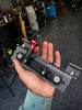 JC Customs OBS Ford Fire Extinguisher Mount bracket with red knob on speckled gray base