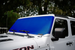 Solar shade for Jeep Wrangler/Gladiator in blue by SpiderWebShade, installed on the windshield.