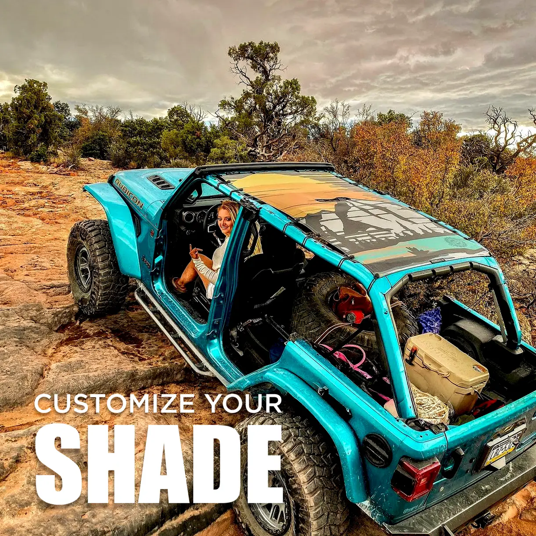 Custom Printed Shade Top SunShade on turquoise Jeep roof; desert rocky trail background