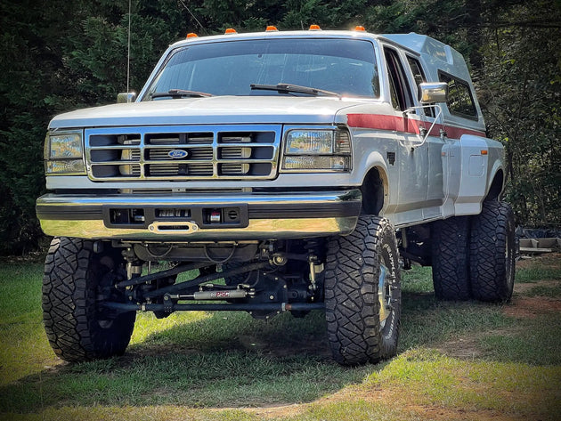 JC Customs OBS Ford Hidden Winch Mount on white Ford OBS pickup with camper shell
