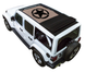 SpiderWebShade sunshade for Jeep Wrangler JLU Sky One Touch Power Top; tan stock-printed shade with black star logo on white 4-door Jeep