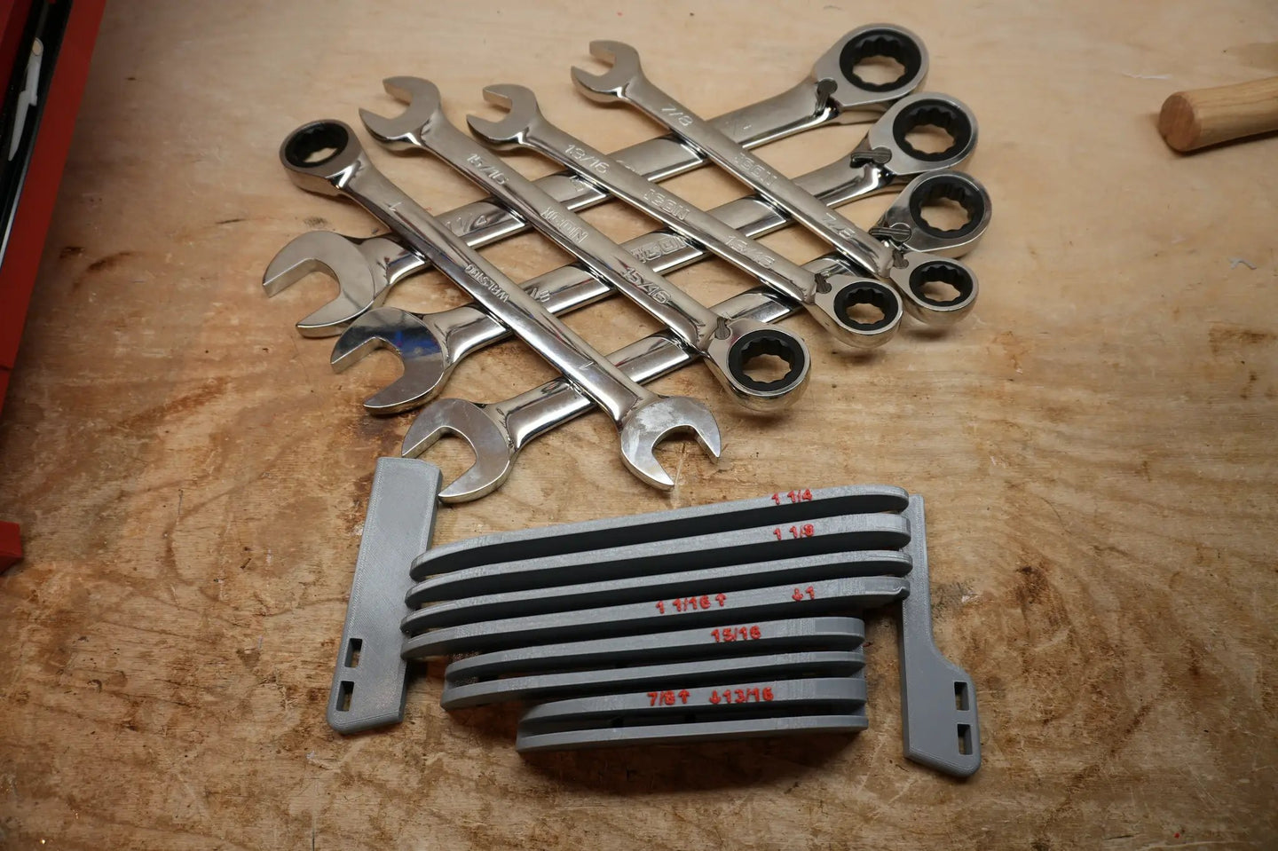 Packout Drawer Inserts for ICON Large Combination Wrench Set IRW-S D LF; gray plastic rails with chrome wrenches on a wooden workbench