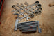 Packout Drawer Inserts for ICON Large Combination Wrench Set IRW-S D LF; gray plastic rails with chrome wrenches on a wooden workbench