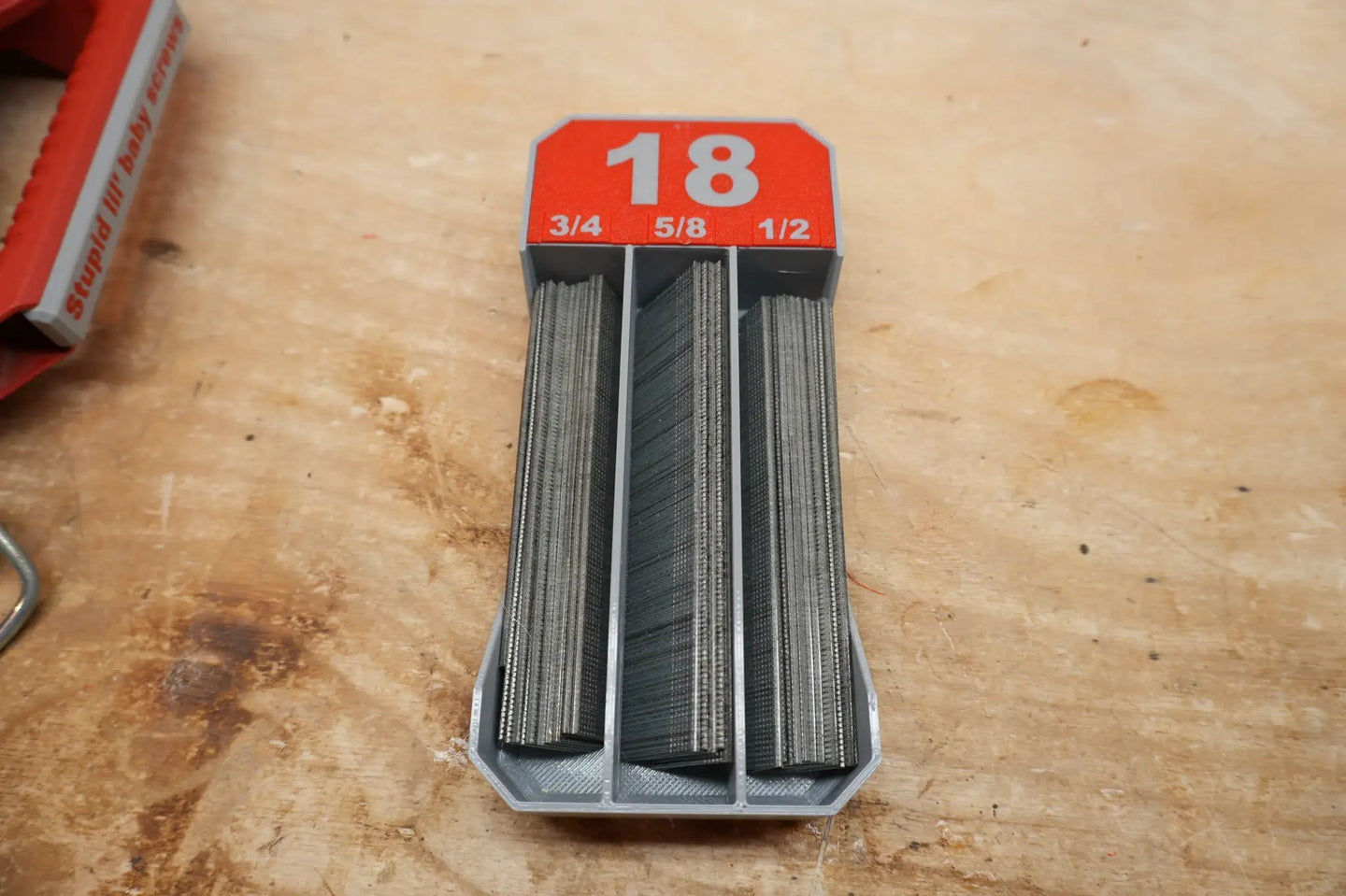 10-Spot Tools LPNB18 Low-Profile Packout Brad Nail Tray Dividers in gray plastic with red top labeled 18 and 3/4 5/8 1/2