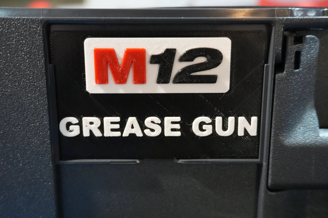 SYS-MGG Systainer Insert for M12 Grease Gun; white label with orange M and black 12 on black case