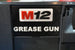SYS-MGG Systainer Insert for M12 Grease Gun; white label with orange M and black 12 on black case