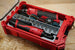 Packout SideCar Insert for M12 3/8 Ratchet ScMR2457 in red Milwaukee Packout case with socket rail and abrasive discs
