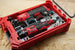 Packout SideCar Insert for M12 Rotary Tool, gray plastic organizer inside red Milwaukee Packout case
