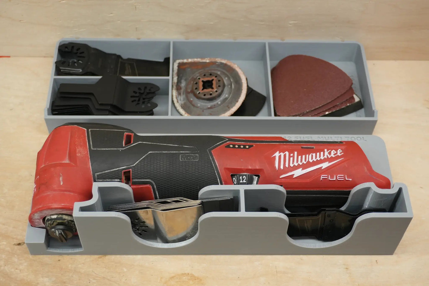 Packout SideCar Insert for M12 FUEL Multi Tool ScMFMT; gray plastic organizer with blades and sanding discs.