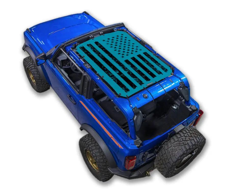 Sun shade for Ford Bronco (2021–2026) by SPIDERWEBSHADE with teal/black flag print