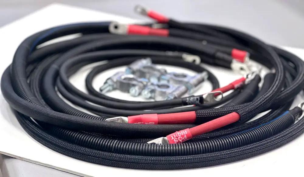 Battery cable replacement harness for Dodge/RAM Cummins 4th Gen (2010–2018) by Big7Kits; black braided cables with red ends