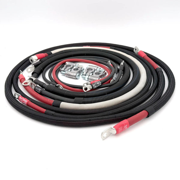 Dodge Cummins 3rd Gen battery cable kit by Big7Kits; coiled red and black heavy-duty cables with lug ends.