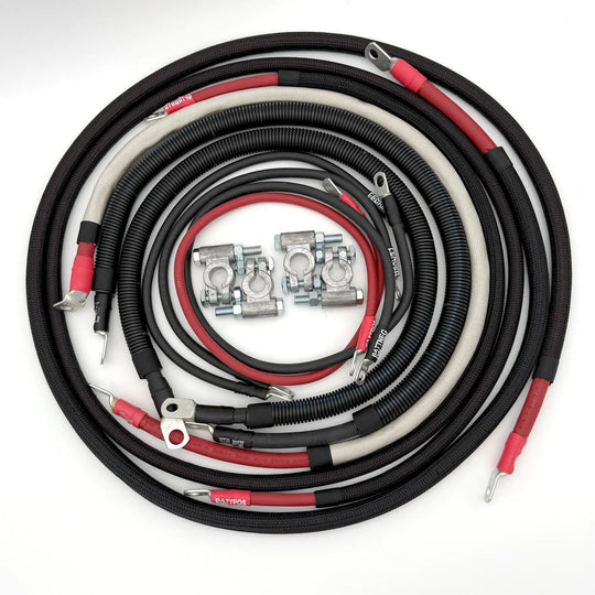 Battery cable kit for Dodge Cummins 3rd Gen (2003–2009) with braided black sleeves and red/black leads by Big7Kits