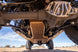 Artec JLU 392 Bellypan Skid with MagnaFlow Exhaust Skid, tan coated steel, underside view on Jeep Wrangler JL