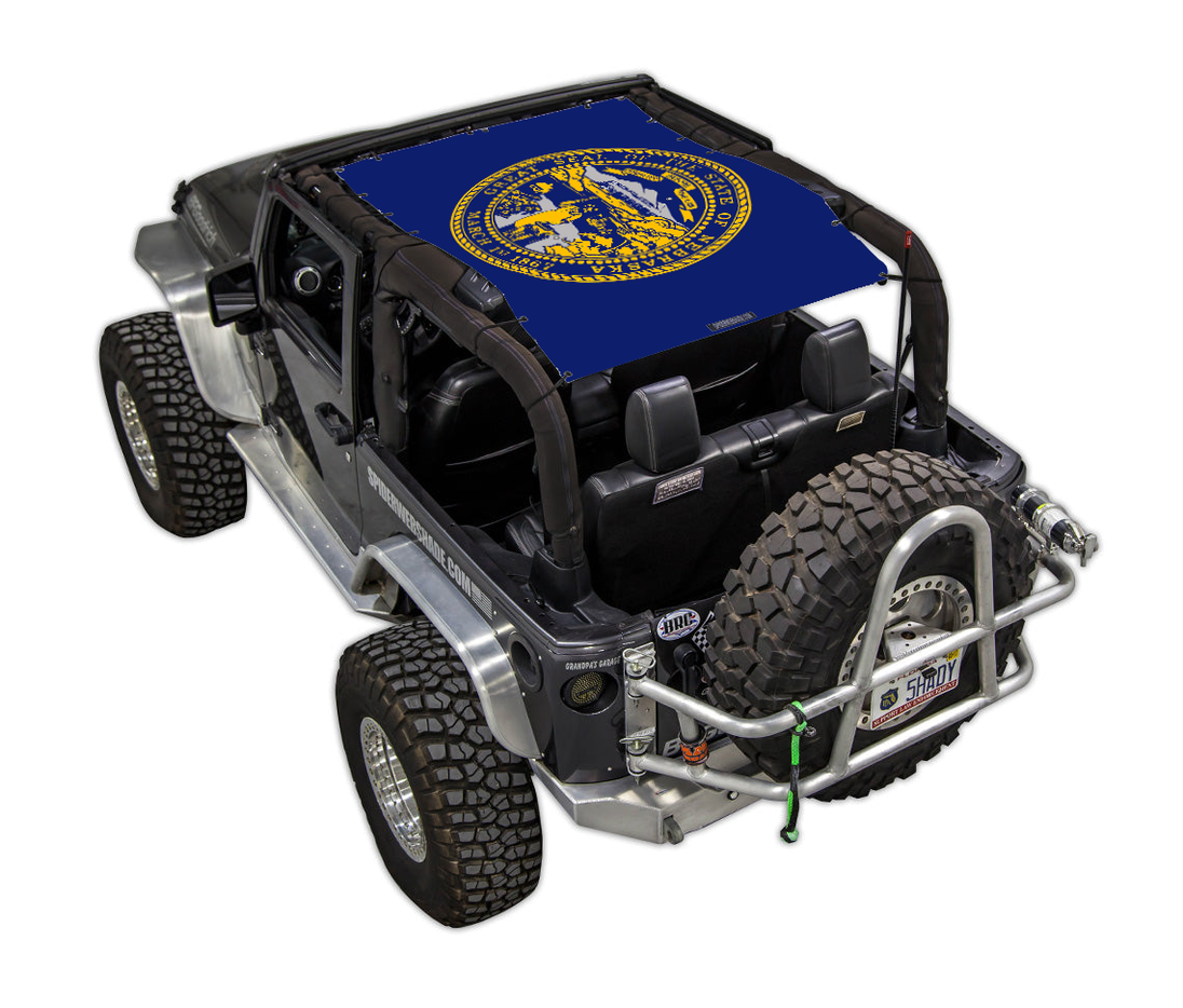 Sun shade for Jeep Wrangler JK 2-Door by SpiderWebShade, blue stock-printed top with yellow seal emblem
