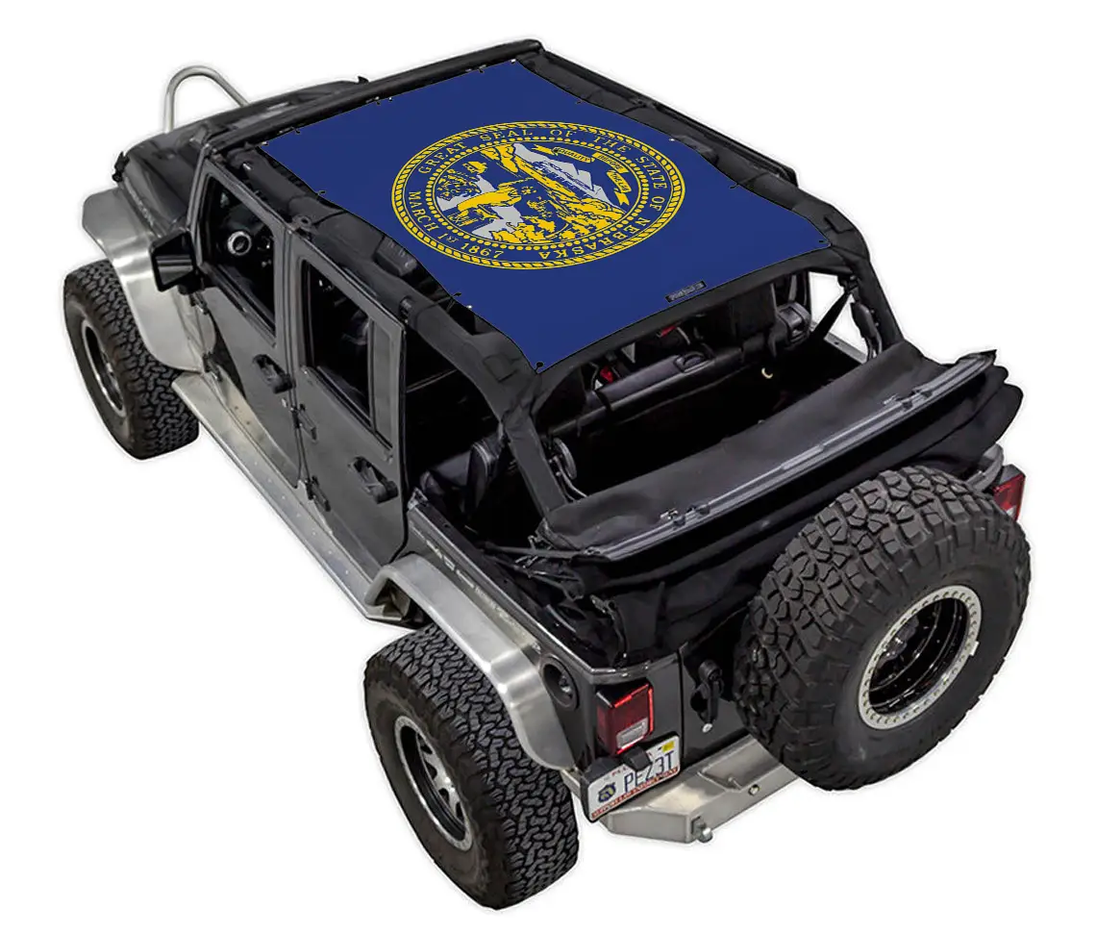 SpiderwebShade sun shade for Jeep Wrangler JKU 4-Door (2007–2017); blue printed top with yellow circular seal logo