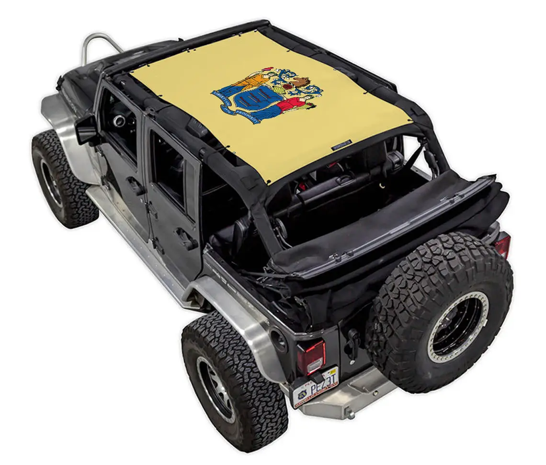 SpiderWebShade sun shade top for Jeep Wrangler JKU 4-Door; yellow stock-printed shade with crest design.