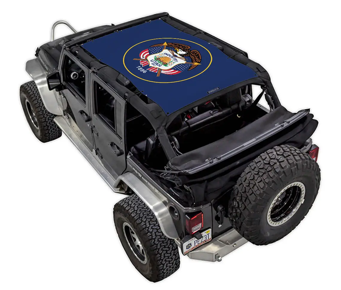 Sun shade top for Jeep Wrangler JKU 4-Door by SpiderWebShade, stock printed blue shade with circular emblem.
