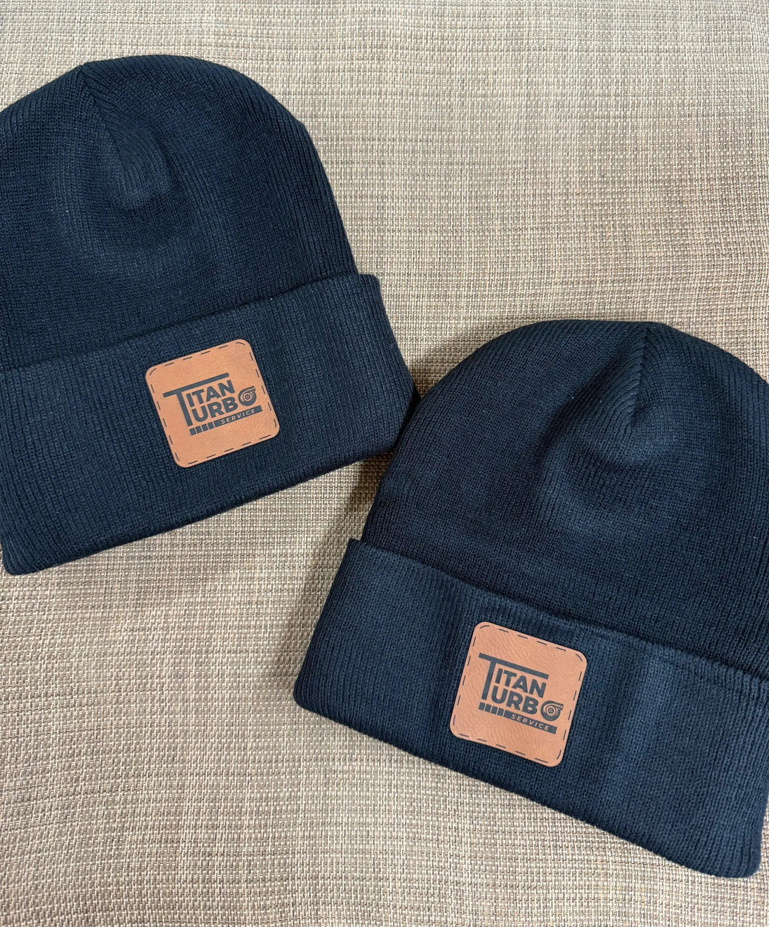 Titan Turbo Beanie navy knit with tan leather patch displaying Titan Turbo Service logo