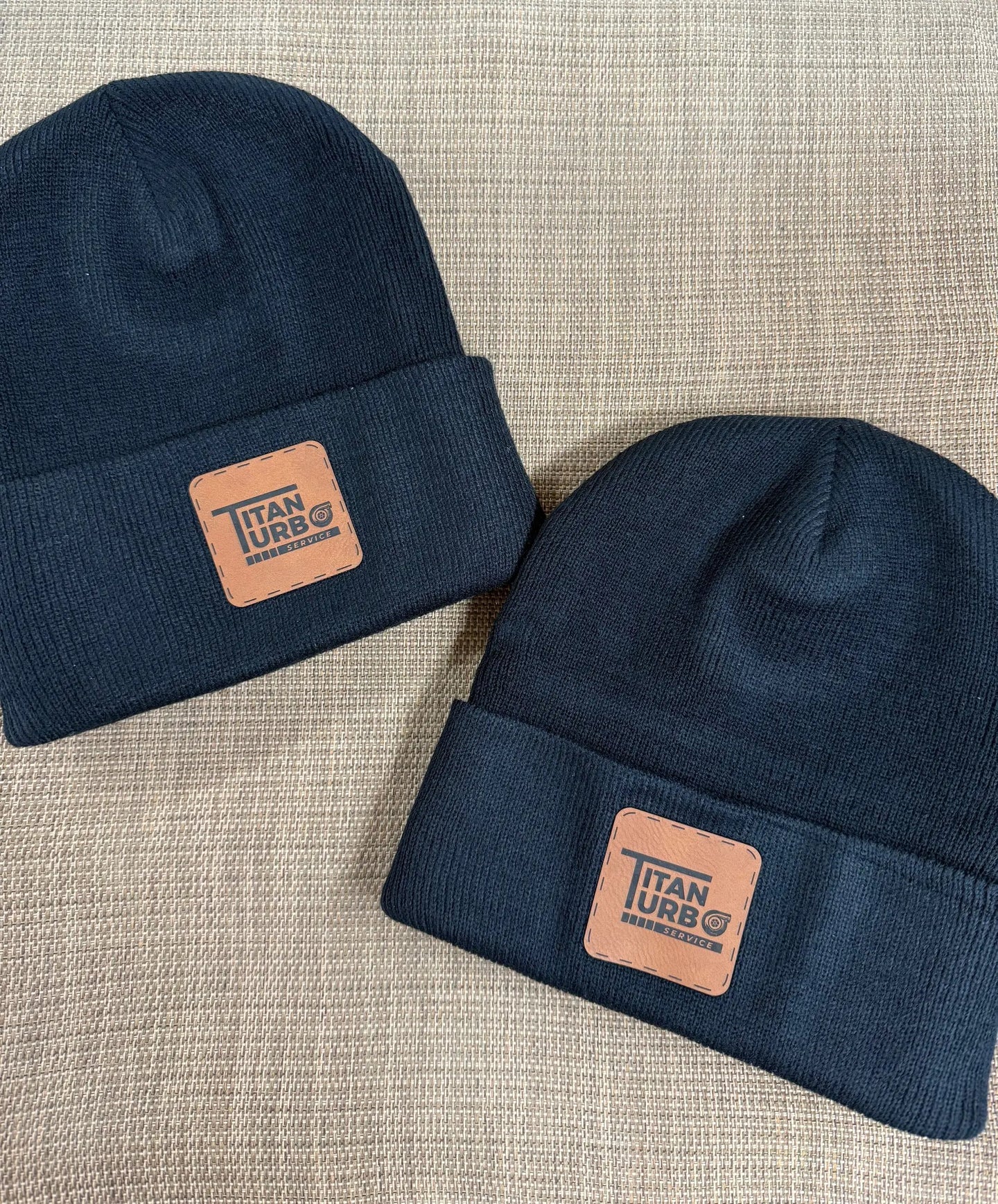 Titan Turbo Beanie navy knit with tan leather patch displaying Titan Turbo Service logo