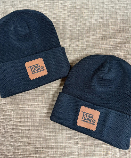 Titan Turbo Beanie navy knit with tan leather patch displaying Titan Turbo Service logo