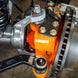Artec Superduty High Steer Cap-Spacer high steer kit on orange front knuckle with bolts