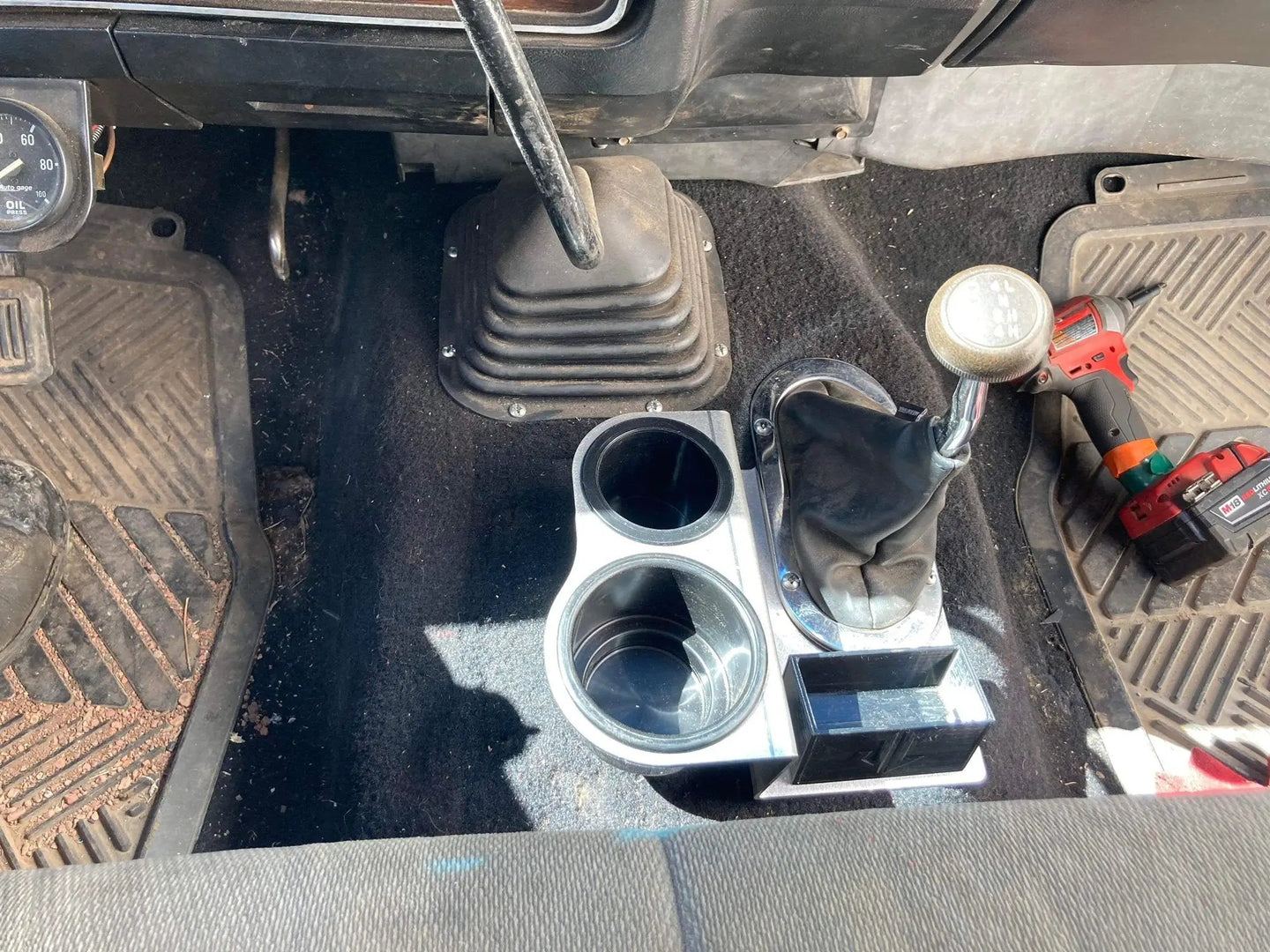 JC Customs Shifter Mounted Cup Holder for 1st Gen Dodge Ram; chrome triple cup holder beside the central shifter boot
