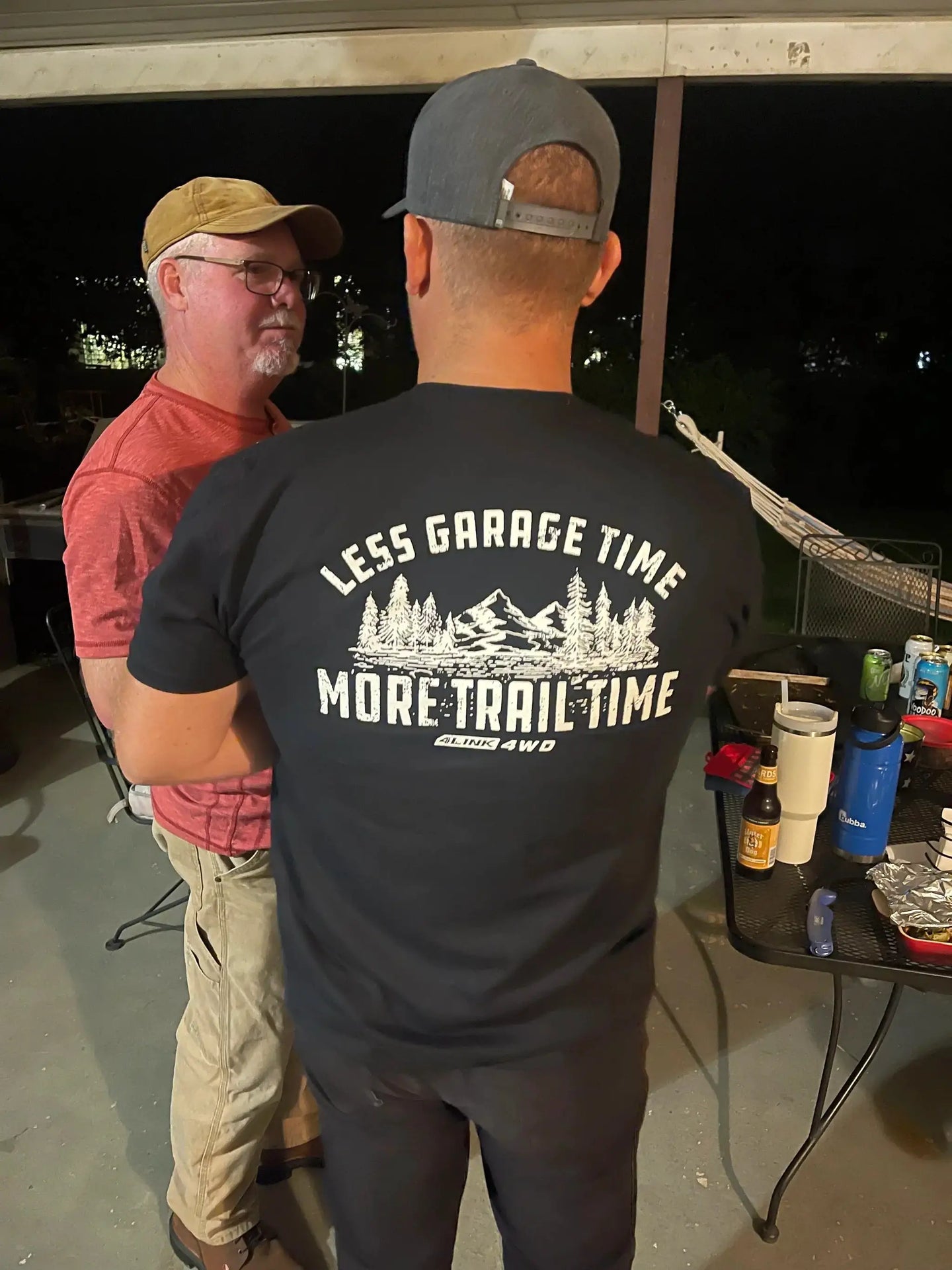 4Link4WD Soft Tee black shirt back view with white mountain graphic and 'Less Garage Time, More Trail Time' text.