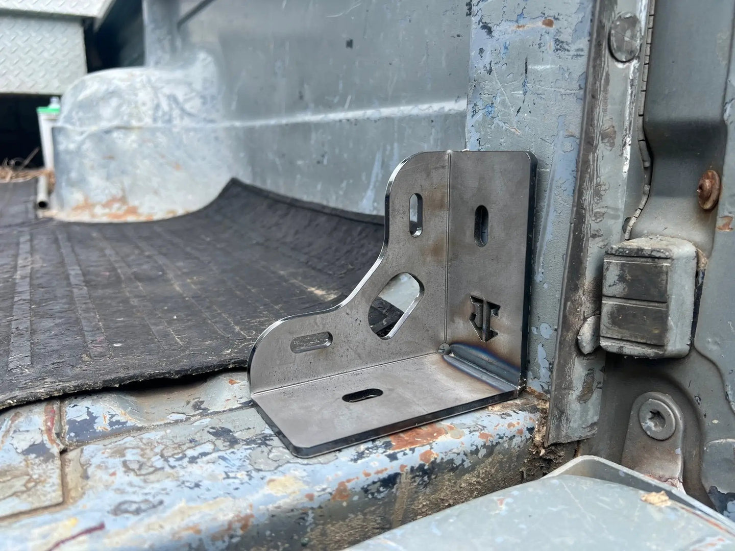 JC Customs Ford 80-97 F-Series Mini Bed Stiffeners/Tie-Downs bracket, steel, installed in the truck bed