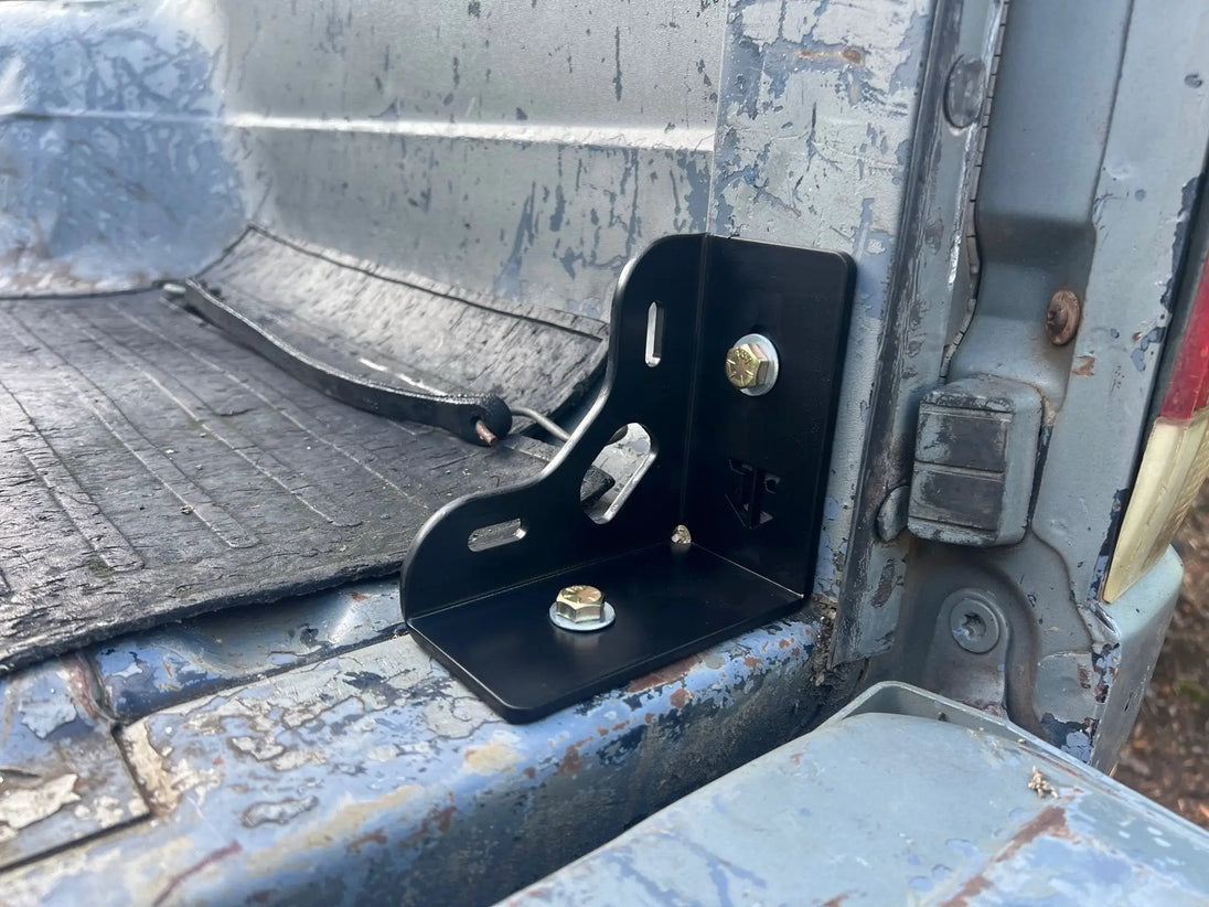 Ford 80-97 F-Series Mini Bed Stiffeners/Tie Downs JC Customs, black steel bracket mounted in truck bed