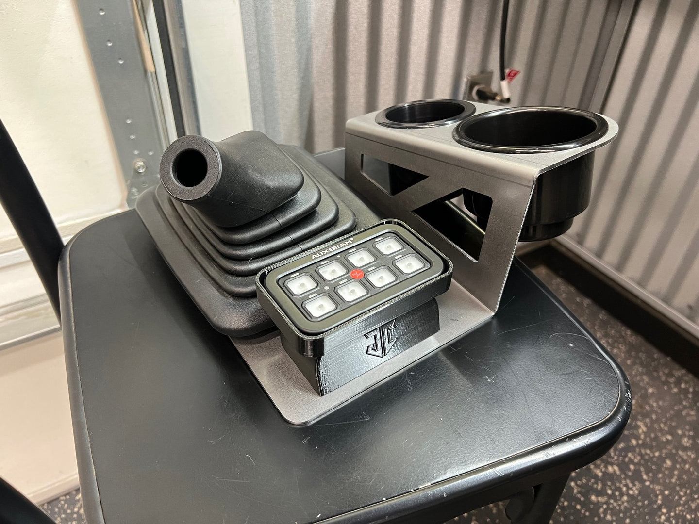 JC Customs OBS Ford F-Series shifter-mounted cup holder; dual chrome-ringed openings in silver bracket