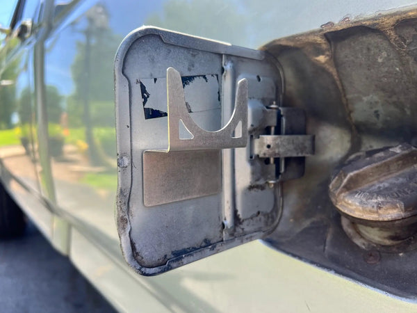 Gas Cap Holder OBS Ford 80-97 JC Customs, metal bracket with curved U-hook at fuel filler area