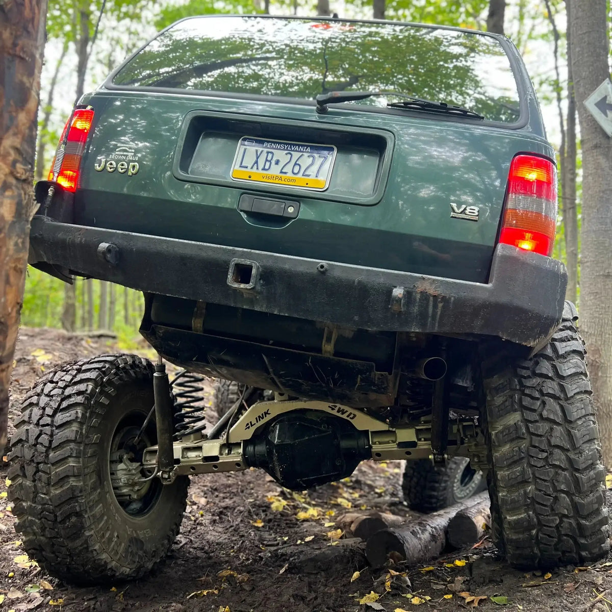 Sterling 10.5 Bolt-On Axle Swap Bracket Kit V.3 by 4Link4WD on a lifted Jeep with mud tires