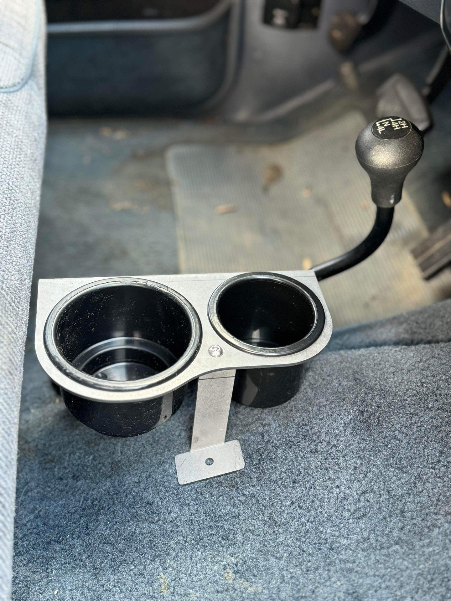 JC Customs Ford F-Series auto shifter mounted cup holder with dual black plastic cups and metal bracket