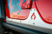JLU Aluminum Rocker Armor Artec Industries rocker panel guard mounted on red vehicle side
