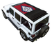 Sun shade top for Jeep Wrangler JLU (2018–2026) by SpiderWebShade, Arkansas flag print, black fabric rolled on white SUV