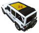 Sun shade for Jeep Wrangler JLU by SPIDERWEBSHADE; yellow stock-printed shade on white Jeep with rolled-back black top
