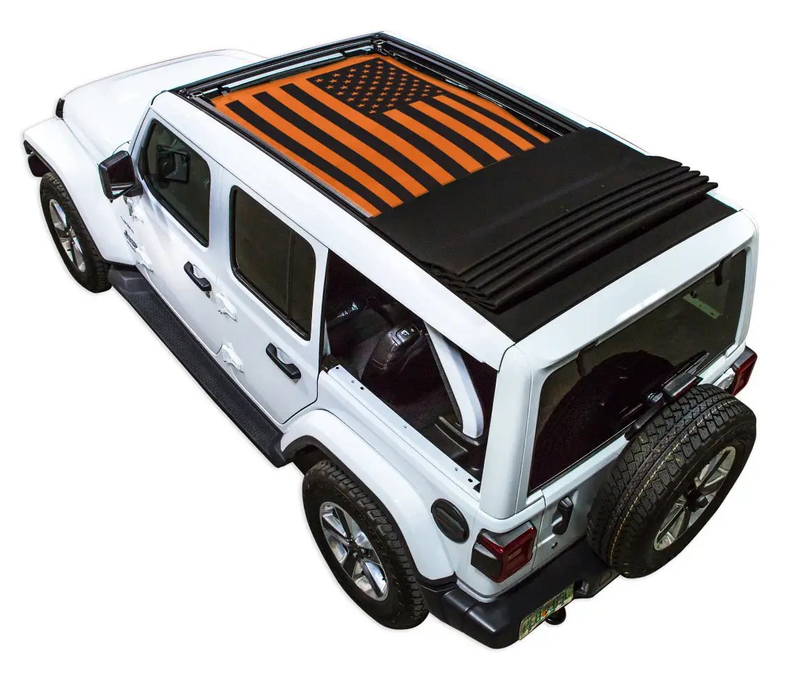 SpiderWebShade sun shade top for Jeep Wrangler JLU; stock printed orange/black US flag design on white four-door SUV