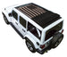 Sun shade top for Jeep Wrangler JLU by SpiderWebShade; black printed shade with American flag print on white 4-door SUV