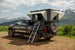Aluminum side-opening roof top tent by Smittybilt on a pickup, beige canvas with ladder