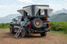 Aluminum side-opening roof top tent on pickup with ladder, Smittybilt.
